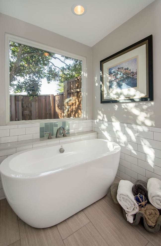 Inspiration for a mid-sized contemporary master bathroom in Los Angeles with shaker cabinets, dark wood cabinets, a curbless shower, a one-piece toilet, multi-coloured tile, porcelain tile, beige walls, plywood floors, an integrated sink, solid surface benchtops, beige floor, a sliding shower screen and white benchtops.