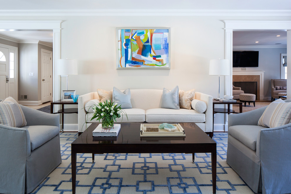 This is an example of a transitional living room in New York with white walls and no fireplace.