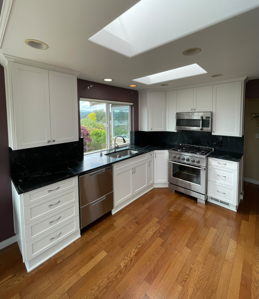 Custom White Kitchen Remodel With Black Quartz Counters