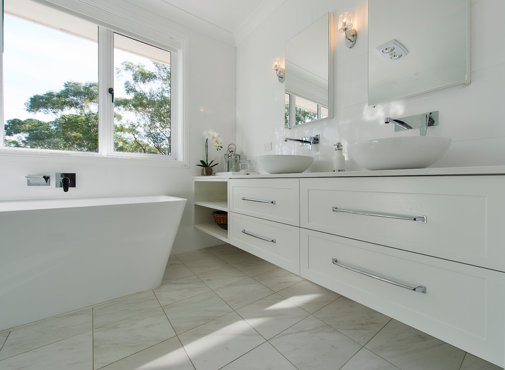 This is an example of a large contemporary master bathroom in Sydney with shaker cabinets, dark hardwood floors, brown floor, white cabinets, a freestanding tub, a corner shower, white tile, porcelain tile, engineered quartz benchtops and an open shower.