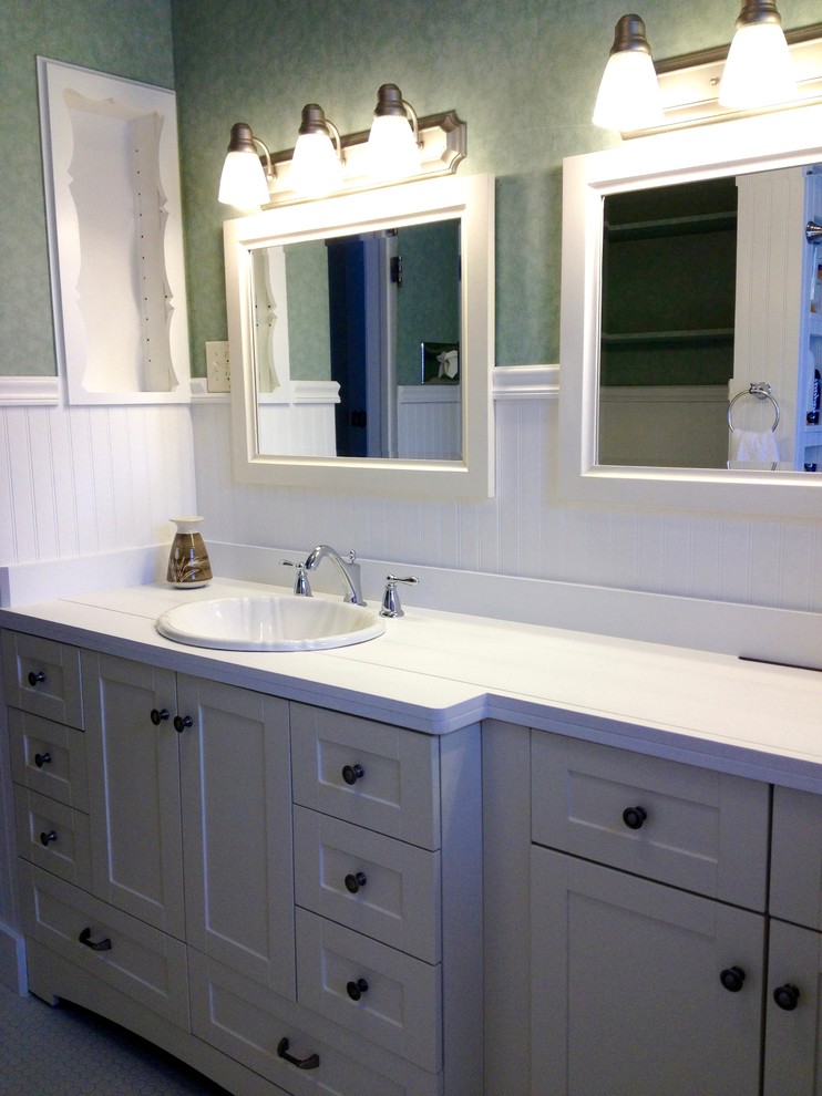 Inspiration for a traditional bathroom in Denver with white tile, porcelain tile, green walls and porcelain floors.