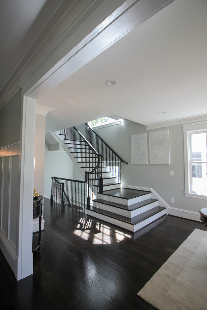 Large transitional wooden l-shaped mixed material railing staircase photo in DC Metro with painted risers