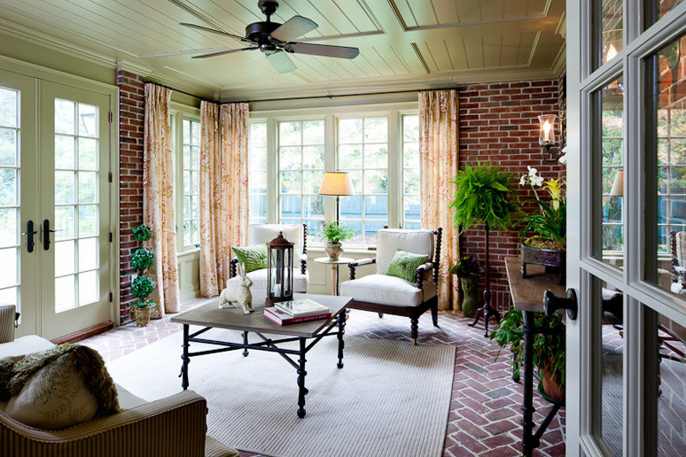 Photo of a large traditional sunroom in Boston.