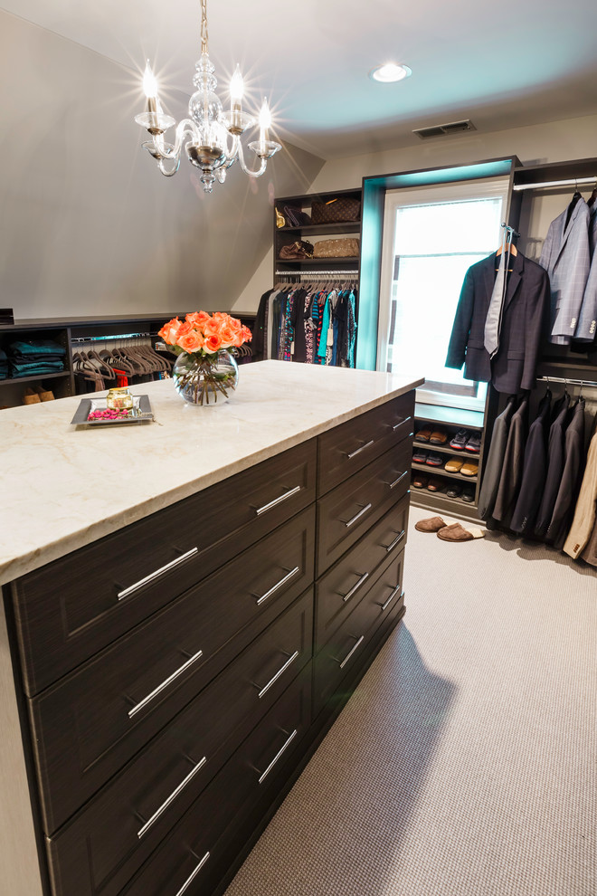 Mid-sized transitional storage and wardrobe in Chicago with flat-panel cabinets, grey cabinets and limestone floors.