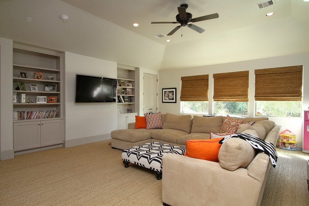 Photo of an expansive transitional enclosed family room in Houston with a game room, grey walls and a wall-mounted tv.