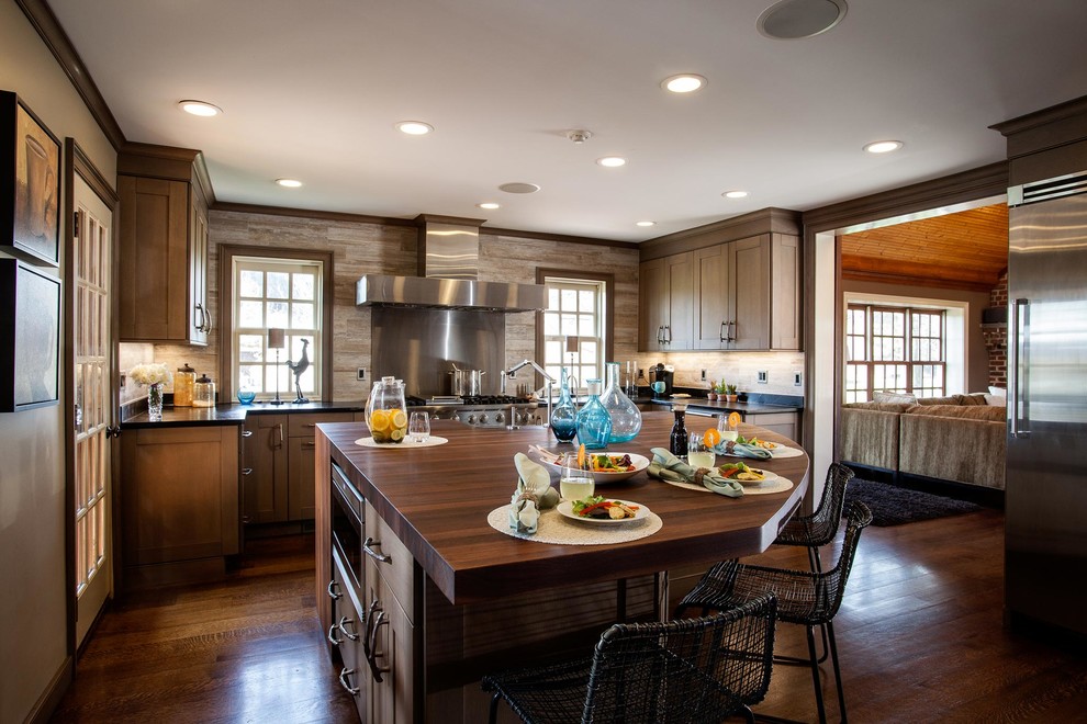 Inspiration for a mid-sized country l-shaped separate kitchen in Other with a farmhouse sink, shaker cabinets, medium wood cabinets, brown splashback, stainless steel appliances, dark hardwood floors and with island.