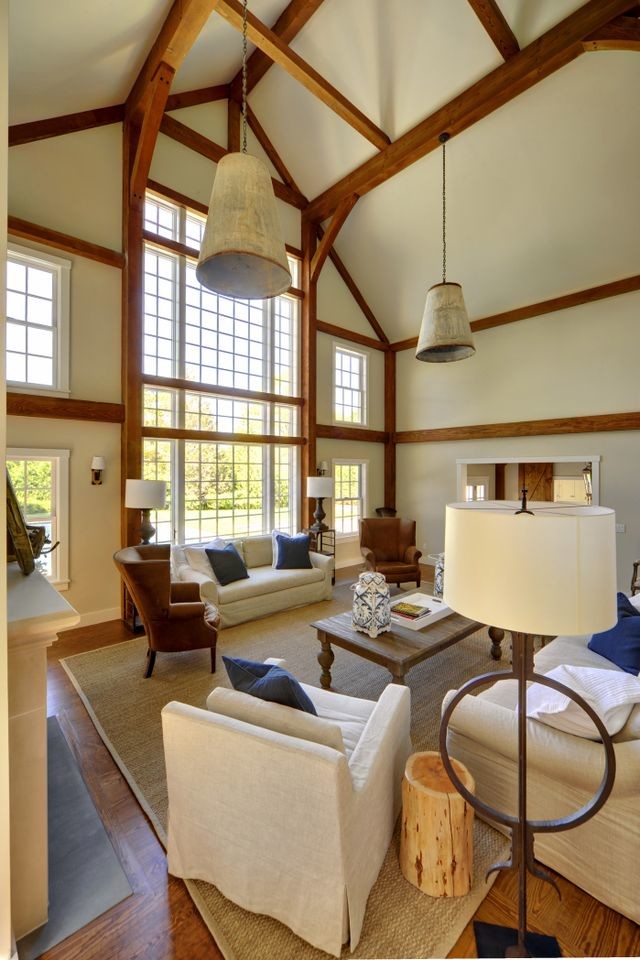 Inspiration for a large traditional open concept living room in New York with beige walls and medium hardwood floors.