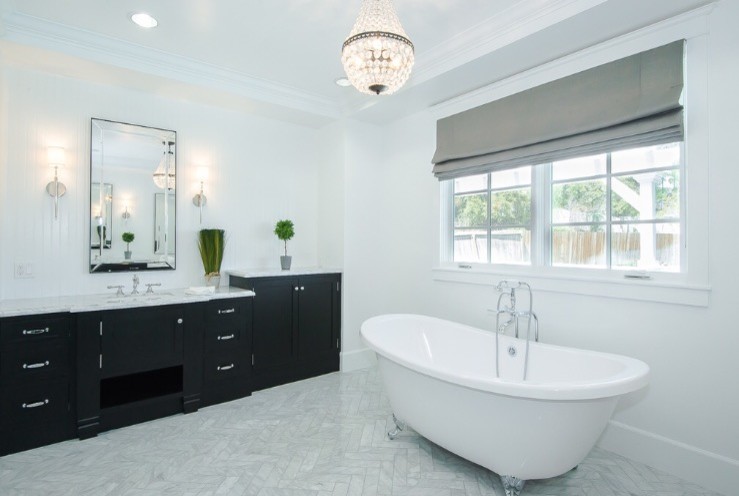 This is an example of a mid-sized contemporary master bathroom in San Francisco with shaker cabinets, black cabinets, a claw-foot tub, a corner shower, white walls, marble floors, an undermount sink, marble benchtops and white floor.