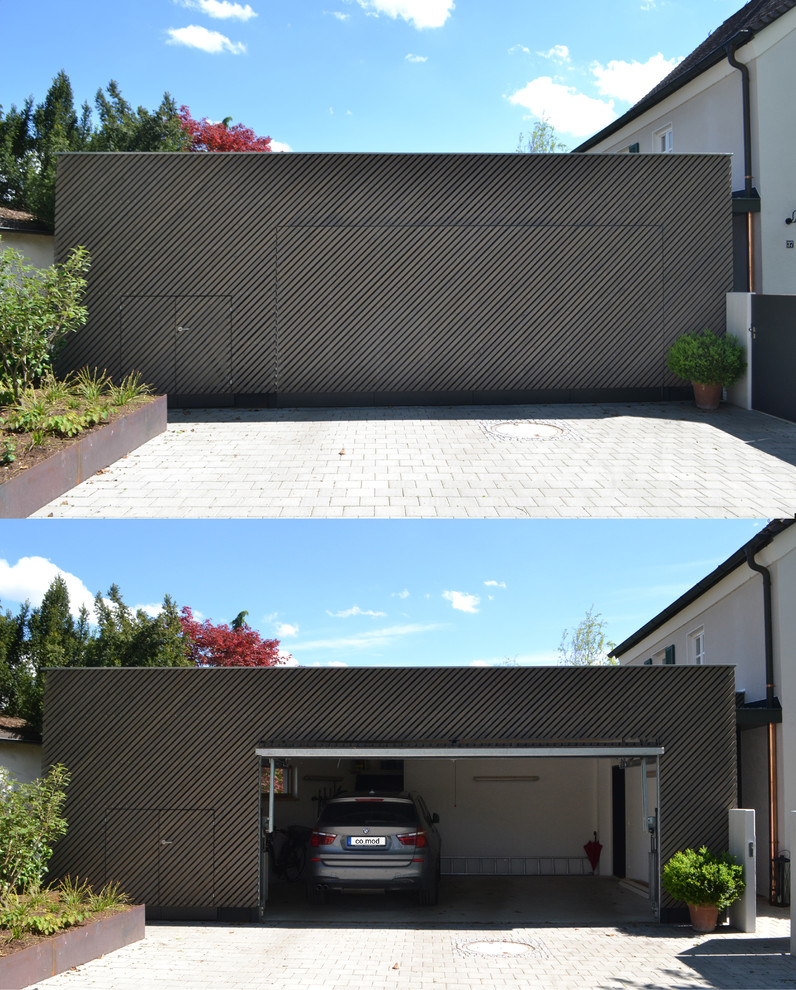 Photo of a mid-sized contemporary attached two-car garage in Munich.
