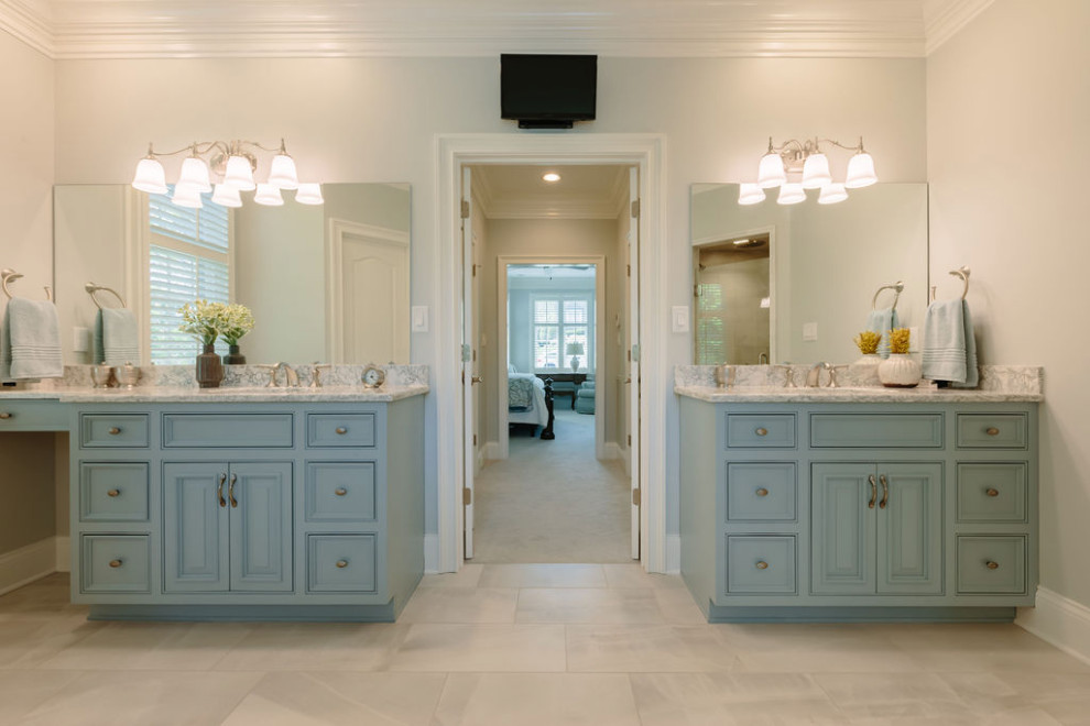 Mid-sized transitional master white tile porcelain tile, gray floor, single-sink and wall paneling freestanding bathtub photo with beaded inset cabinets, blue cabinets, a one-piece toilet, white walls, an undermount sink, quartz countertops, a hinged shower door, white countertops and a built-in vanity