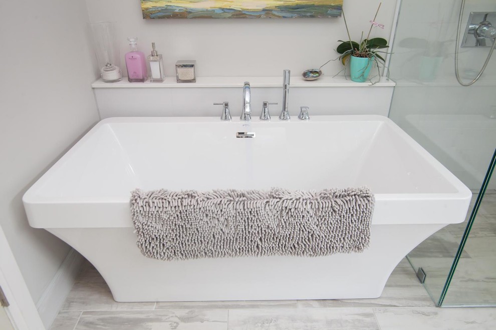 Inspiration for a mid-sized contemporary master bathroom in Toronto with shaker cabinets, white cabinets, a corner shower, a two-piece toilet, multi-coloured tile, porcelain tile, grey walls, an undermount sink, granite benchtops, a hinged shower door, beige benchtops, a single vanity and a built-in vanity.