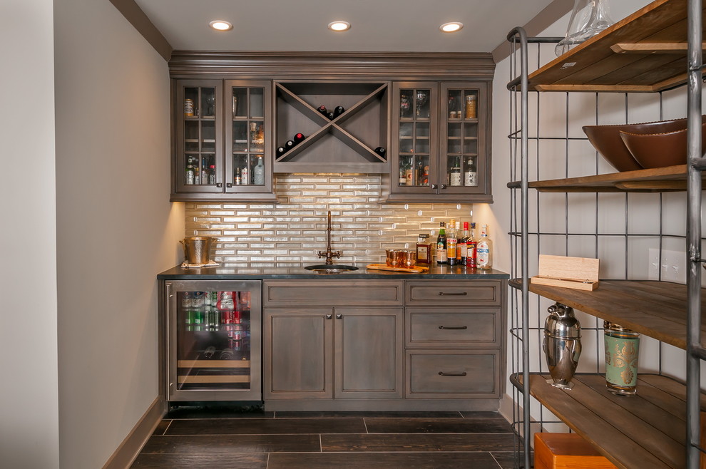 Photo of a small traditional single-wall wet bar in Atlanta with an undermount sink, recessed-panel cabinets and distressed cabinets.