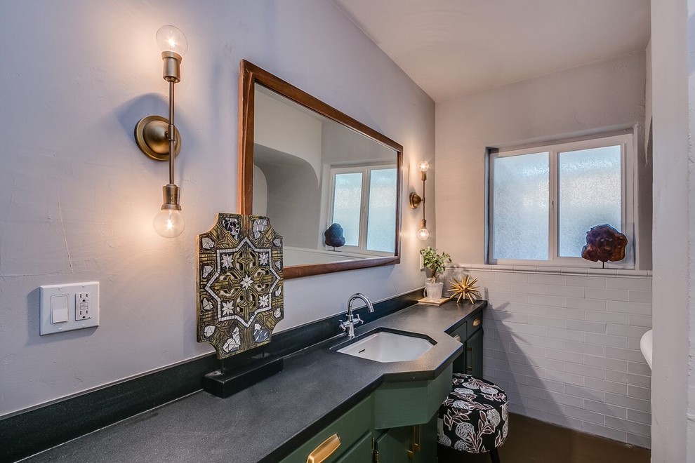 Inspiration for a mid-sized transitional white tile and subway tile concrete floor and brown floor bathroom remodel in Phoenix with flat-panel cabinets, green cabinets, gray walls and an undermount sink