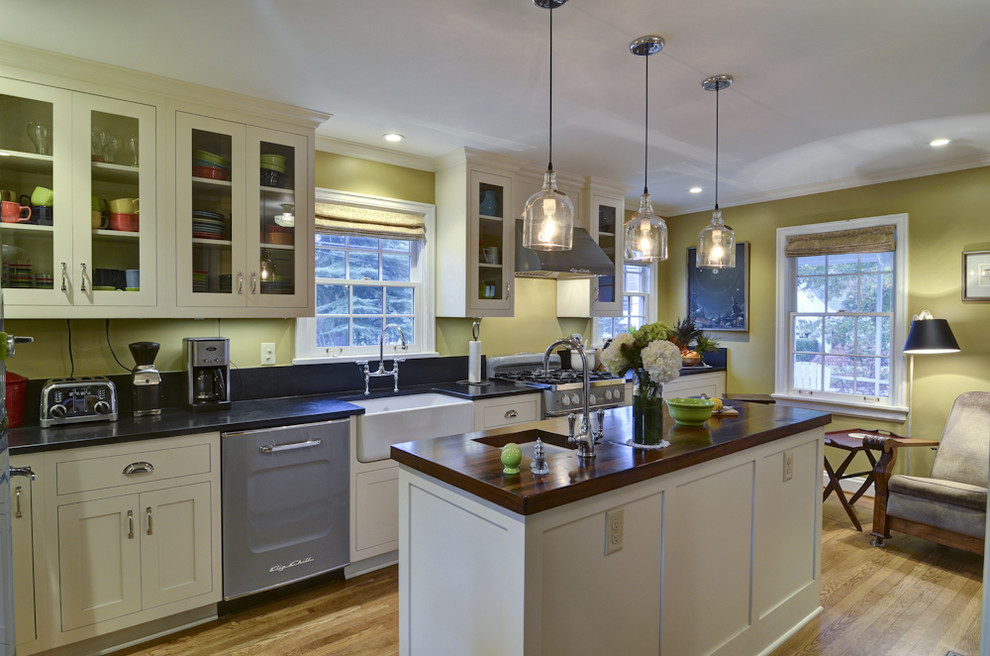 Photo of a traditional kitchen in Atlanta with a farmhouse sink and yellow splashback.