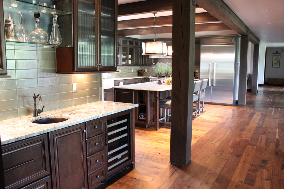 Inspiration for a rustic medium tone wood floor kitchen remodel with an undermount sink, glass-front cabinets, dark wood cabinets, granite countertops, ceramic backsplash and stainless steel appliances