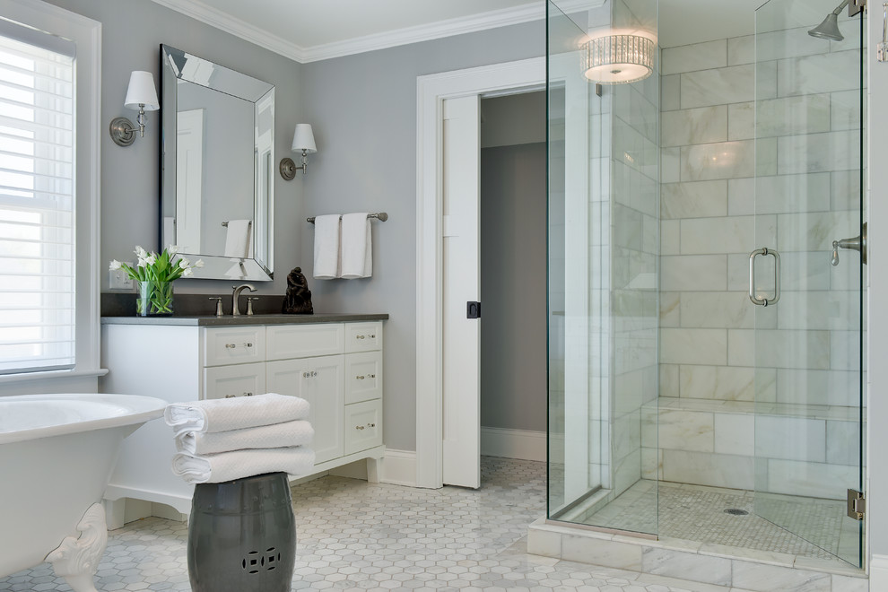 Design ideas for a mid-sized beach style master bathroom in Phoenix with shaker cabinets, white cabinets, a claw-foot tub, white tile, grey walls, white floor, a hinged shower door, marble, marble floors, a corner shower, an undermount sink and grey benchtops.