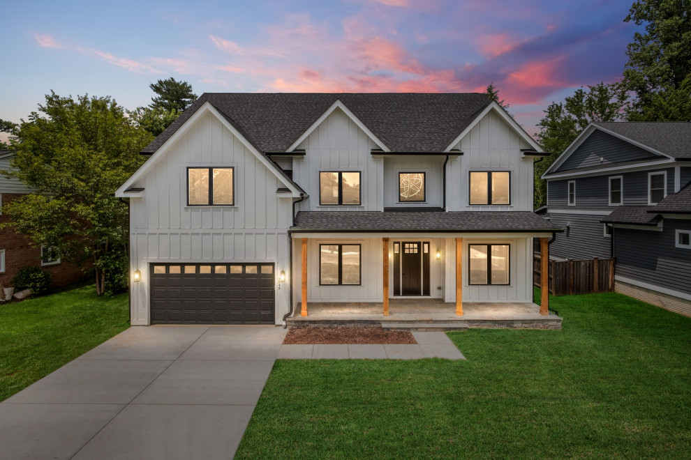 Mid-sized contemporary two-storey white house exterior in DC Metro with concrete fiberboard siding, a hip roof, a shingle roof, a black roof and board and batten siding.