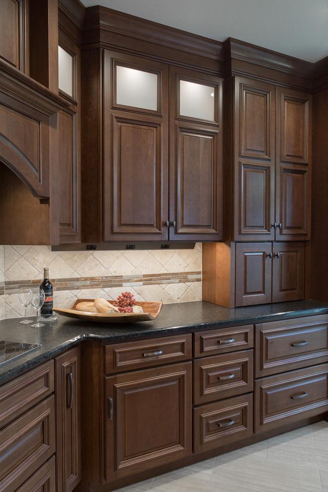 Large transitional kitchen photo with an undermount sink, raised-panel cabinets, stainless steel appliances and an island