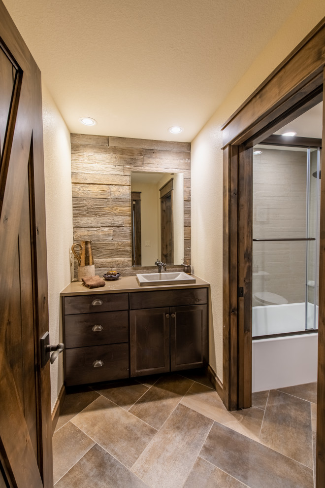 Inspiration for a medium sized bathroom in Denver with dark wood cabinets, brown tiles, wood-effect tiles, beige walls, ceramic flooring, brown floors, beige worktops, an enclosed toilet, a single sink, a built in vanity unit and wood walls.