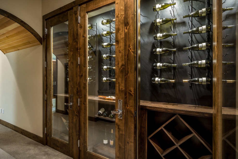 Mid-sized asian wine cellar in Other with display racks.