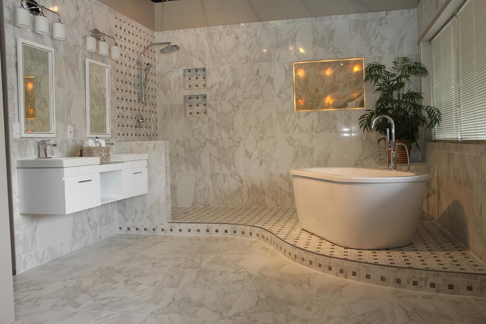 Photo of a large transitional master bathroom in DC Metro with a vessel sink, flat-panel cabinets, white cabinets, glass benchtops, a freestanding tub, an open shower, a two-piece toilet, white tile, porcelain tile, white walls and porcelain floors.