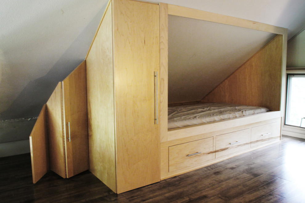 This is an example of a large modern loft-style bedroom in Other.