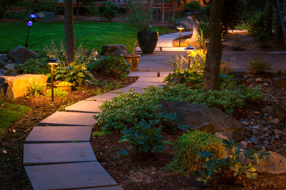 Design ideas for a mid-sized midcentury backyard full sun garden for summer in Portland with a garden path and concrete pavers.