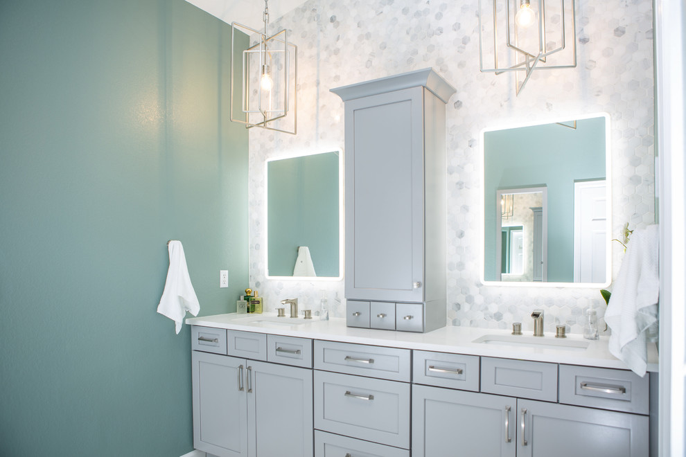 Design ideas for a large transitional master bathroom in Denver with shaker cabinets, grey cabinets, a freestanding tub, an alcove shower, a one-piece toilet, green tile, marble, green walls, porcelain floors, an undermount sink, engineered quartz benchtops, brown floor, a hinged shower door and white benchtops.