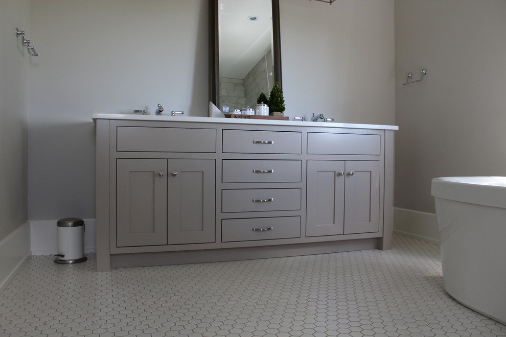 Inspiration for a large transitional bathroom remodel in Toronto with shaker cabinets, gray cabinets, gray walls, an undermount sink and quartz countertops