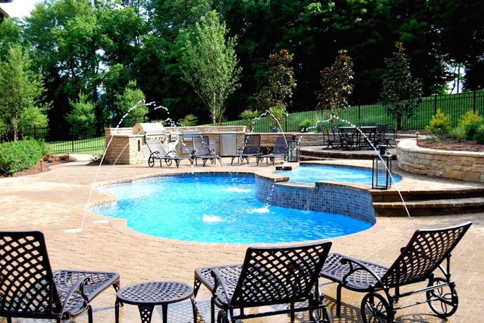 Pool fountain - mid-sized transitional backyard concrete and rectangular pool fountain idea in Nashville