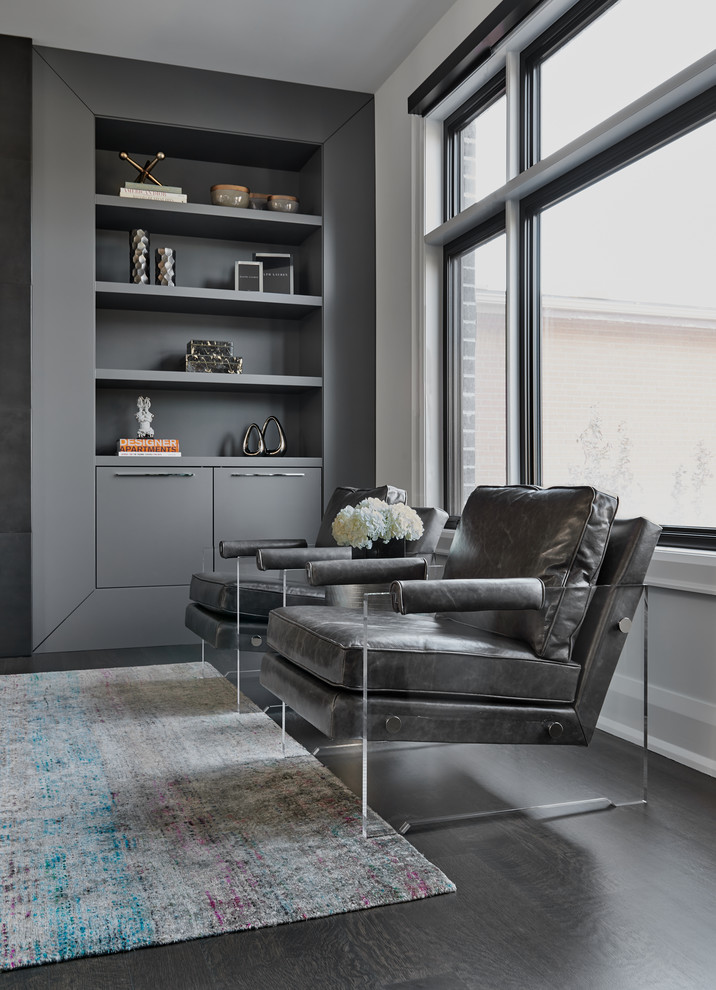 Mid-sized contemporary open concept family room in Toronto with grey walls, dark hardwood floors, a metal fireplace surround, a wall-mounted tv and brown floor.