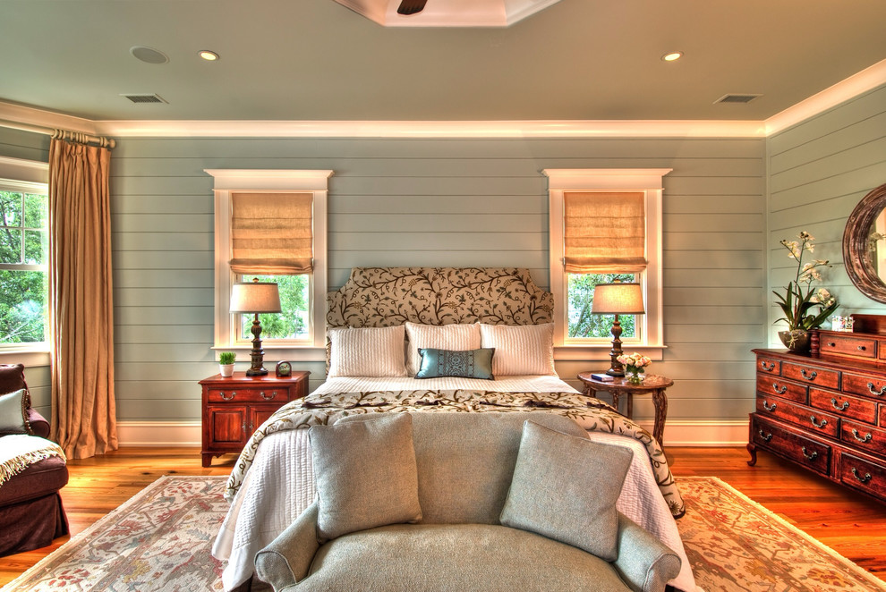 Inspiration for a traditional bedroom in Charleston with grey walls and medium hardwood floors.