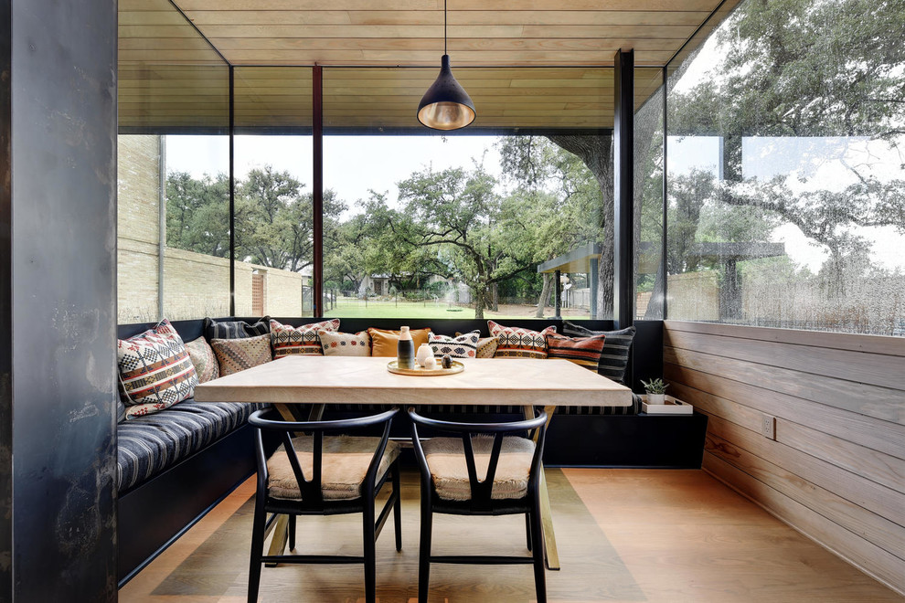 Inspiration for a mid-sized transitional open plan dining in Austin with white walls, light hardwood floors, no fireplace and beige floor.