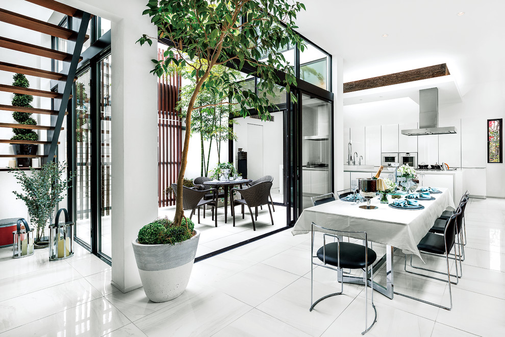 Design ideas for a contemporary open plan dining in Tokyo Suburbs with white walls and white floor.