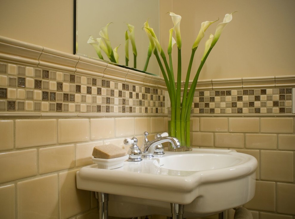 Inspiration for a mid-sized transitional beige tile and ceramic tile bathroom remodel with beige walls and a pedestal sink