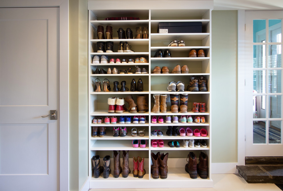 Inspiration for a mid-sized transitional mudroom in New York with green walls, porcelain floors and multi-coloured floor.