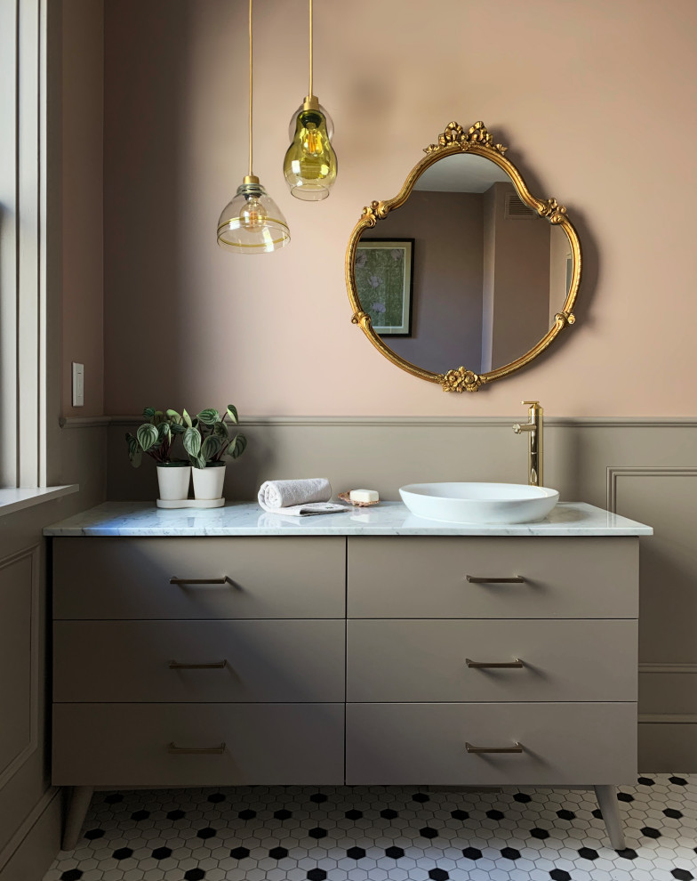 Large eclectic bathroom in Philadelphia with flat-panel cabinets, beige cabinets, pink walls, ceramic floors, a vessel sink, marble benchtops, white benchtops, a single vanity, a freestanding vanity and decorative wall panelling.