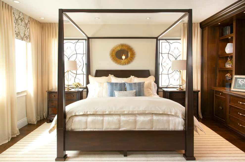 Design ideas for a large traditional master bedroom in San Diego with beige walls and dark hardwood floors.