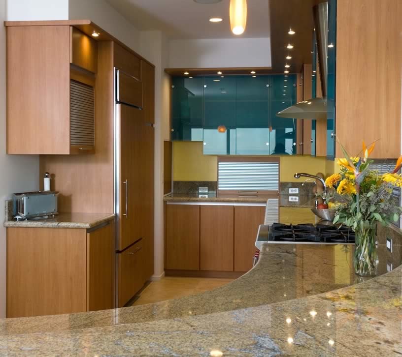 Mid-sized transitional u-shaped beige floor kitchen photo in Phoenix with flat-panel cabinets, medium tone wood cabinets, yellow backsplash, paneled appliances and a peninsula