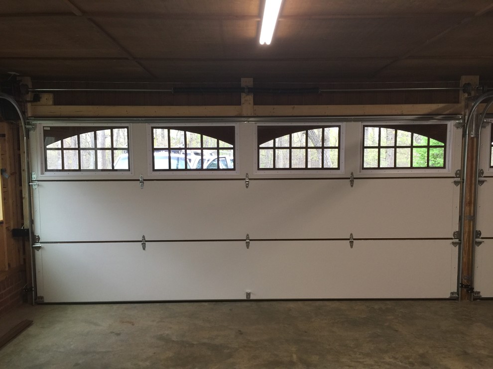 Garage - large traditional attached two-car garage idea in Seattle