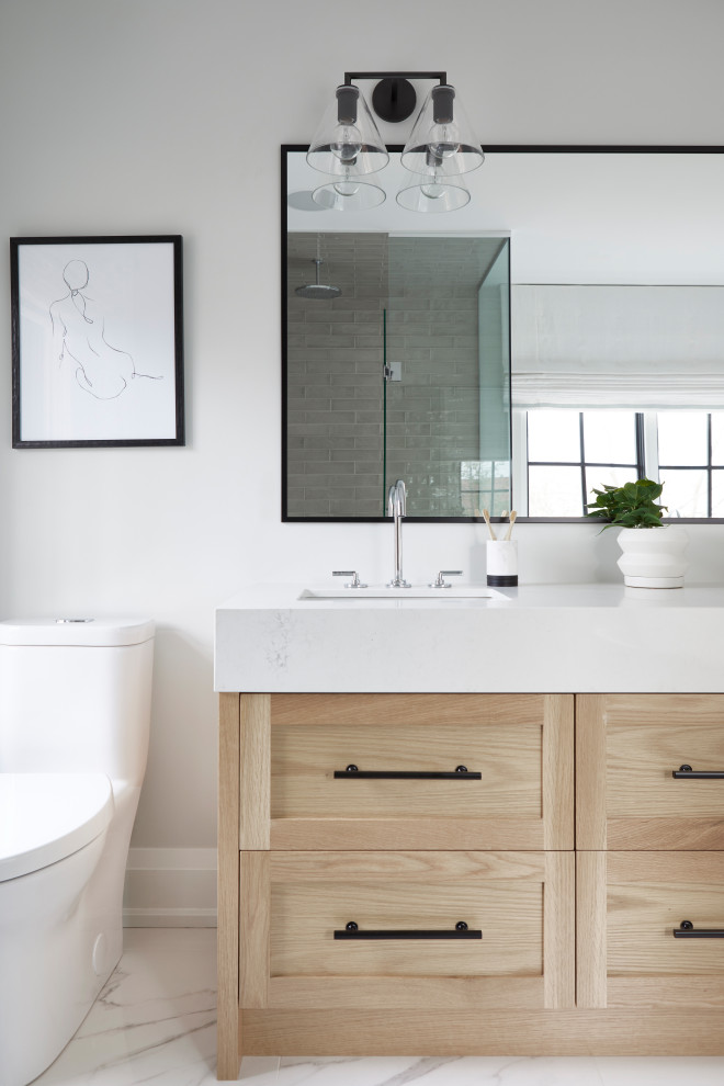 Design ideas for a large transitional master bathroom in Toronto with shaker cabinets, light wood cabinets, a curbless shower, a one-piece toilet, white walls, porcelain floors, an undermount sink, white floor, a hinged shower door, white benchtops, a double vanity and a built-in vanity.