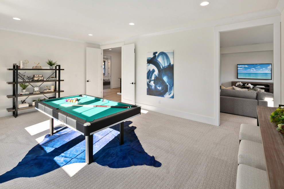 This is an example of a large country enclosed family room in Seattle with a game room, white walls, carpet, grey floor and a built-in media wall.