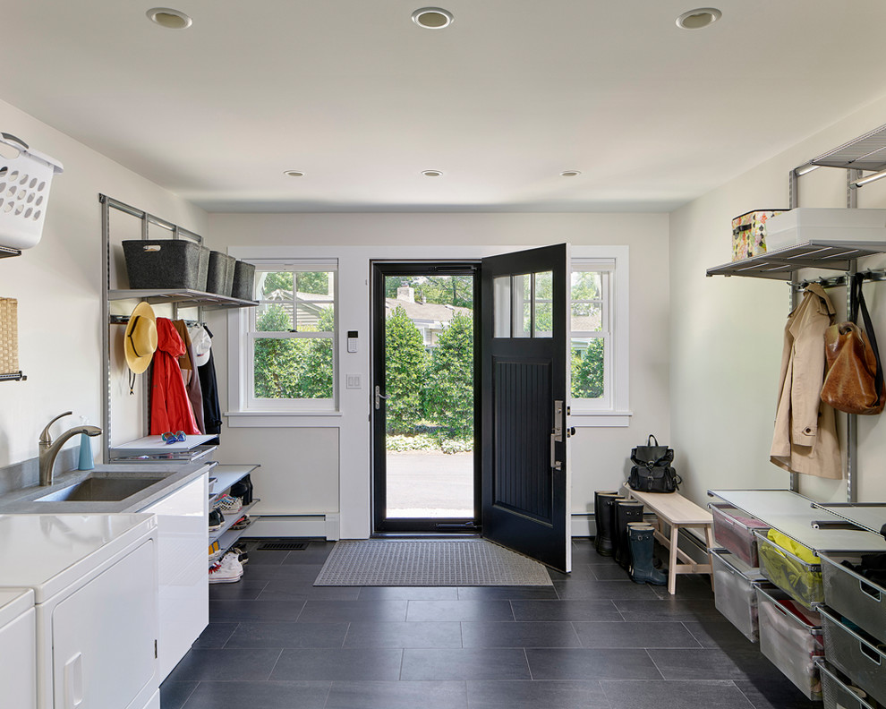 This is an example of a mid-sized transitional mudroom in Philadelphia with white walls, porcelain floors, a single front door, a black front door and grey floor.