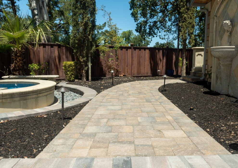 Walkway with interlocking pavers