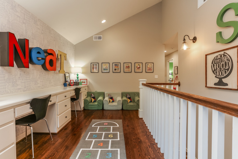 Example of a classic gender-neutral dark wood floor kids' room design in Kansas City with beige walls