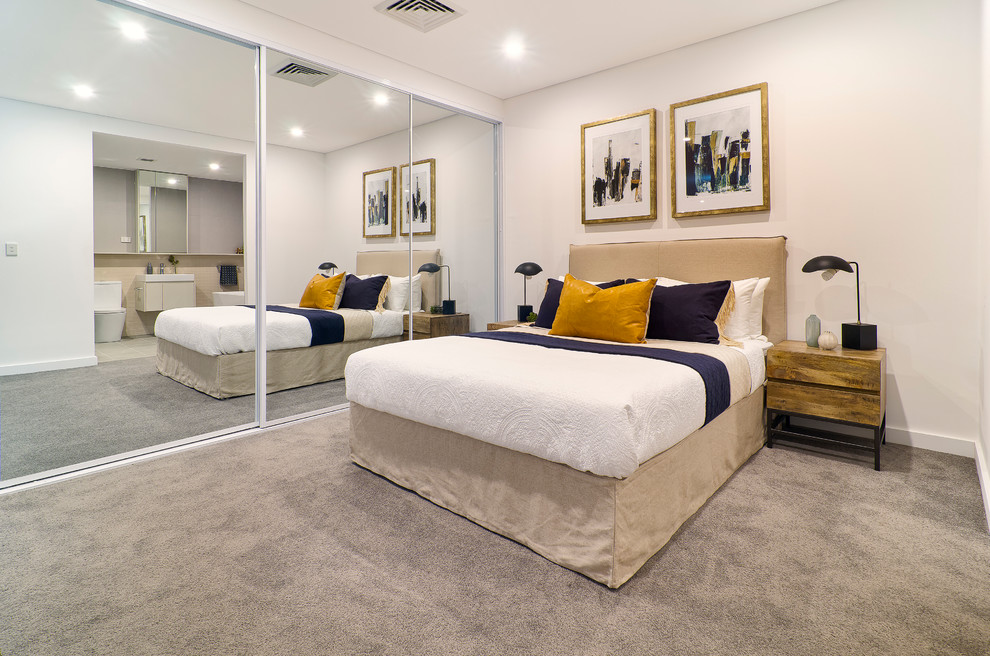 Mid-sized contemporary master bedroom in Sydney with white walls, carpet, no fireplace and grey floor.