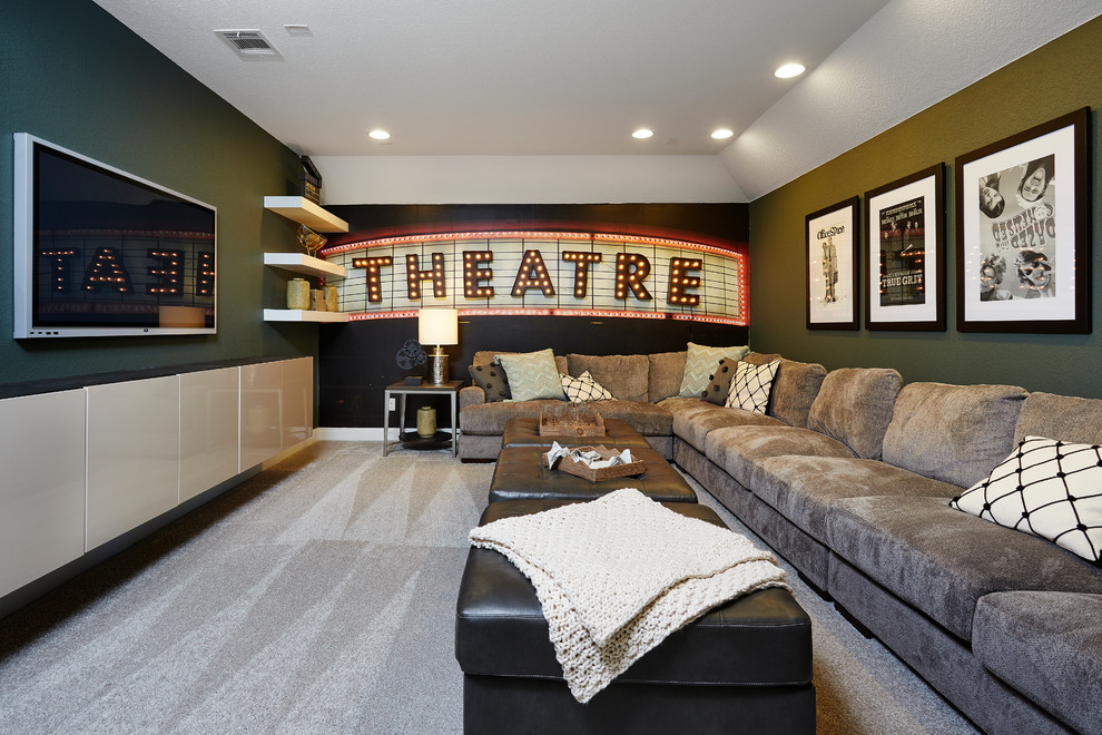 Mid-sized traditional enclosed home theatre in Austin with green walls, carpet and beige floor.