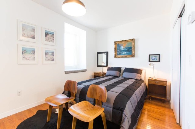 Modern Airbnb Bedroom With Vintage Furniture And Artwork