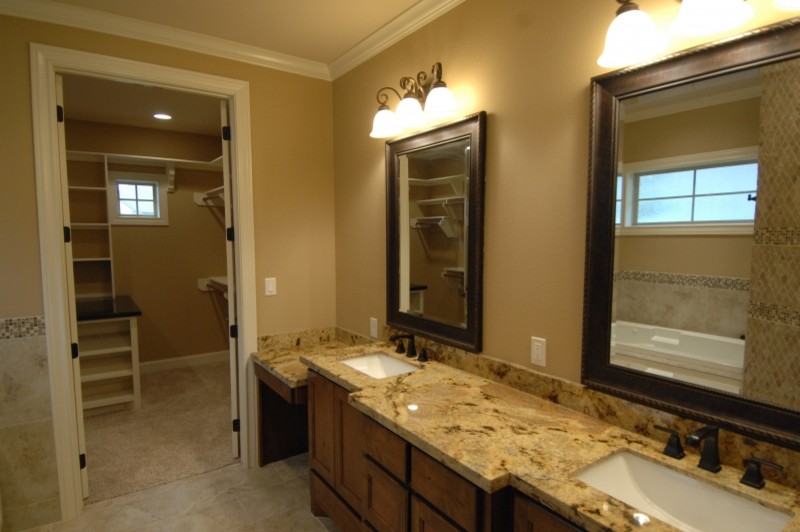 Inspiration for a mid-sized rustic master beige tile and stone tile ceramic tile and gray floor alcove bathtub remodel with raised-panel cabinets, white cabinets, beige walls, an undermount sink and granite countertops