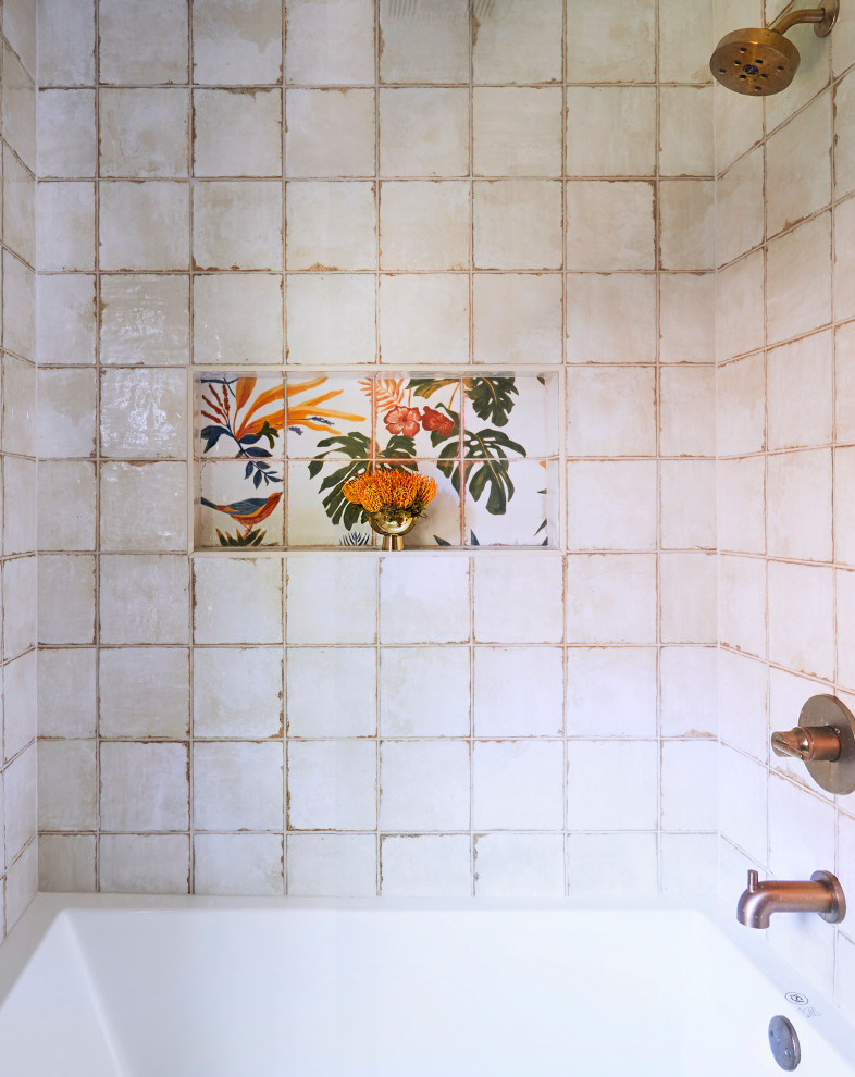 Photo of a small tropical master bathroom in Chicago with shaker cabinets, blue cabinets, a corner tub, a corner shower, a one-piece toilet, multi-coloured tile, mosaic tile, beige walls, ceramic floors, a console sink, engineered quartz benchtops, multi-coloured floor, a hinged shower door, white benchtops, a niche, a single vanity and a built-in vanity.